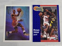 Pair of vintage Michael Jordan basketball cards showing front designs featuring Jordan in Chicago Bulls uniform and 'League Leaders 1992' card