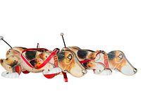 Side view of both vintage 1961 Fisher Price Snoopy Dogs pull toys showing paint detail and body construction.