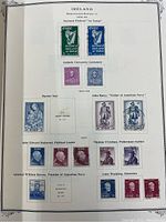 Album page with various Irish postage stamps including National Festival, Catholic University Centenary, Marian Year, and historical figures John Barry, John Edward Redmond, Thomas O'Crohan, Admiral William Brown, and Luke Wadding in different colors.