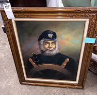 Front view of the framed oil painting showing the ship captain with white beard and pipe.