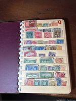 Page labeled 'Q' filled with various colorful Canadian postage stamps, mostly vintage and used.
