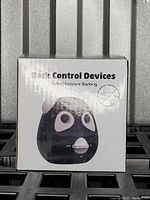 Front view of bark control device box showing product image and basic description.
