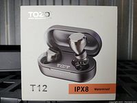 Front of the product box showing TOZO T12 earbuds and charging case image with IPX8 waterproof label.