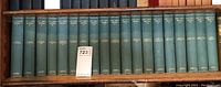 Full set of 19 green hardcover Bret Harte volumes showing all spines lined in a row on a shelf.