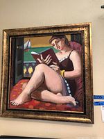 Full front view of framed painting showing reclining woman reading
