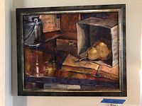 Frontal view of framed oil painting showing still life composition with box, pears, books, and handle container.