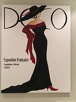 Full view of the canvas print showing the stylized woman in black dress and hat with red accents and the text DECOR, Exposition Française Fashion Show 1925