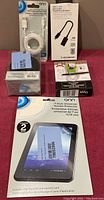Photo showing white USB-C to USB-A cable in original sealed packaging, Cable Matters USB-C to USB-A female adapter in white box, and onn 7-inch universal screen protector with blue and white packaging, plus two other small accessory boxes.