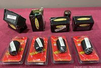 Photo of multiple gear shift knobs from Momo and Skunk2, mostly in packaging.