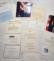 Collection of photos and signed notes displayed on white background, showing various autographs and presidential emblems.