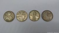 Four USSR Soviet Union 1 Ruble commemorative coins laid out showing obverse and reverse designs.