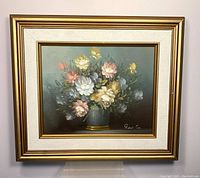 Framed oil painting of a bouquet of flowers in a vase, signed by Robert Cox