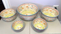 Front view of all five bowls showing sizing and design