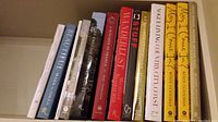 Front view of shelf with all hardcover books showing spines