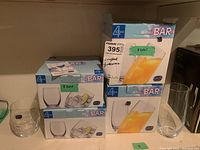 Boxes and a few uncovered tumblers showing 470ml capacity and quantity (eight tumblers in each box)