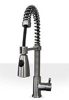 Photo of modern kitchen faucet with coiled spring neck and pull-down spray head with button, showing brushed nickel finish and single lever handle.