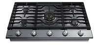 Top-down view of the stainless steel gas cooktop showing five burners and cast iron grates