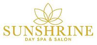 Photo of the Sunshrine Day Spa & Salon logo with gold text and stylized lotus flower.