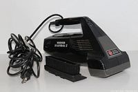 Black Hoover Brush Vac II handheld mini vacuum with brush attachment and power cord