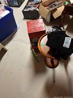 Table with water globe box and black bags on top