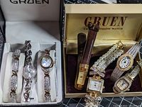Photo showing 6 Gruen ladies wristwatches, including one with leather strap and others with rhinestone encrusted metal bracelets, some with pearl details, untested condition.