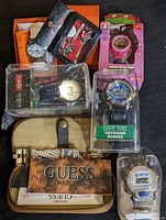 Photo showing complete lot with various watches including Swiss Activa, Timex, Guess, Pepsi, Teenage Mutant Ninja Turtle, and Ed Hardy hair berets
