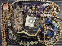 Full assortment of stone jewelry including various necklaces, bracelets, and a pair of earrings.
