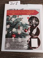 Box front of the Christmas string lights showing product image, snowflake LED lights, and USB power plug.