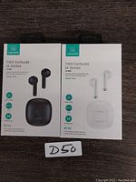 Front view of two USAMS TWS IA Series Earbuds packages, one black set and one white set, both sealed.