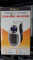 Front of box showing Brightown Personal Electric Ceramic Heater with features like 1-12 hour timer, safety thermal limit fuse, overheat safety shutoff, and 350 watt ceramic heat.
