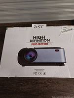 Photo of the high definition projector box showing the product image and branding.