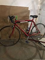 Full side view of red Cannondale Nitro bicycle showing frame, wheels and overall condition