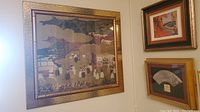 Framed Asian art prints hanging on wall, showing entire setup of 3 pieces