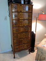 Full front view of the tall lingerie dresser showing inlay details and metal drawer pulls.