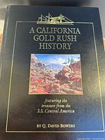 Front cover of the book showing title, author Q. David Bowers, and an illustration of gold rush miners.