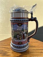 Front view of the Anheuser-Busch beer stein showing the hop gathering scene and detailed trim