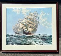 Full view of framed print showing two sailing ships on the ocean with white sails and a partly cloudy sky.