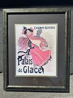 Full frontal image of framed reproduction poster showing dancing couple in pink and gray tones with black lettering.