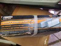 Box of Freeman brand 2 inch, 9 gauge barbed fencing staples, 1000 staples total, 25 staples per strip, constructed of hot dipped galvanized steel