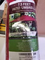 Photo of packaged Blissun 7.5 feet patio umbrella showing product features and branding.