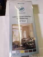 Photo of product packaging showing MYshade Cordless Honeycomb Cellular Shade 30x72 inch blackout window shade in gray.