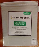 Packaged white Serta Sertapedic Cotton/TENCEL King sheet set showing fiber content and included pieces.