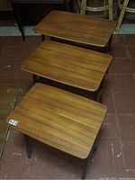 Three tables nest into each other, stacked top view