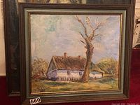 Framed impressionistic oil landscape painting showing house and tree outdoors on board, signed lower left.