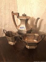 All three pieces displayed together on wooden table