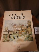 Front cover of the Utrillo art book featuring a color illustration of a village with windmills, showing the title 'Utrillo' and notation of 16 frameable color prints.