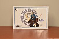 Signed 11x17 print featuring Les Binkley in goalie gear in front of Pittsburgh Penguins logo, with visible certificate of authenticity.