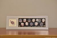 Framed NHL All-Stars Canada Post Stamp of Mike Bossy with an illustrated pathway of historical New York Islanders uniforms.