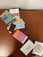 Stocking laid flat on table with six gift cards and brochures stacked
