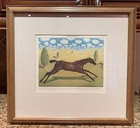 Overall photo of the framed limited edition print showing the horse in dynamic pose within a mat and wood frame.